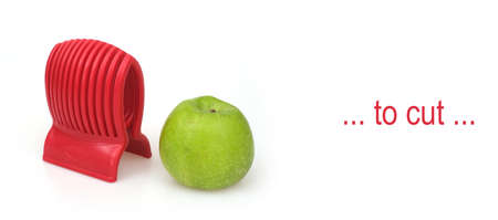 Ripe green apple and red slicer isolated on white backgroundの写真素材