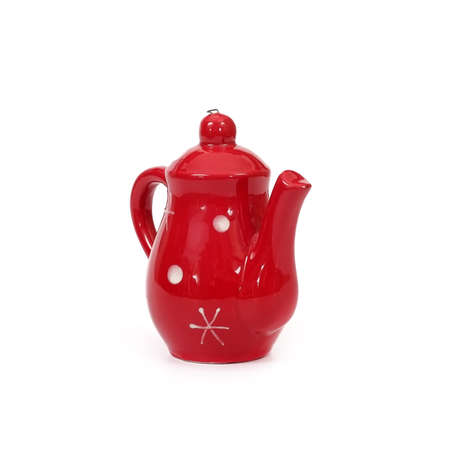 Red ceramic Christmas toy (little kettle) isolated on white backgroundの写真素材