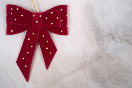 Velvet bow isolated on abstract background