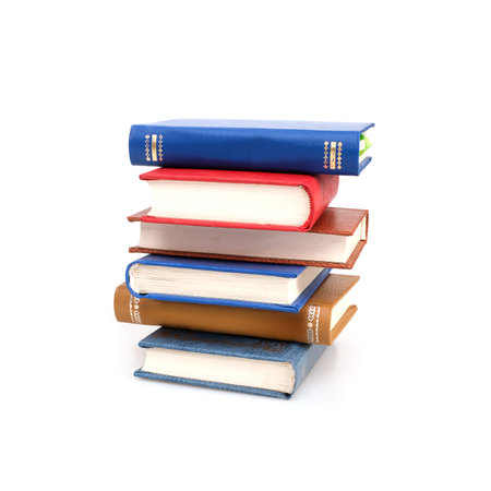 Stack of books in color covers with white sheets isolated on a white backgroundの写真素材