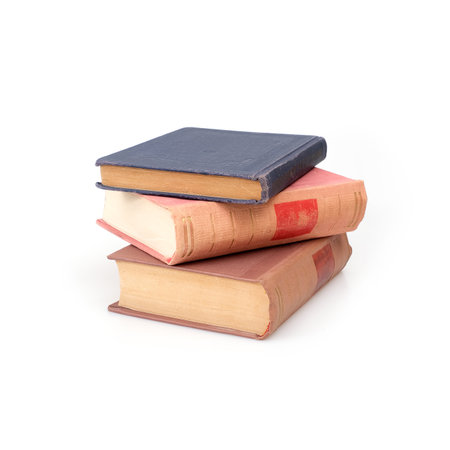 Stack of books in color covers with white sheets isolated on a white backgroundの写真素材