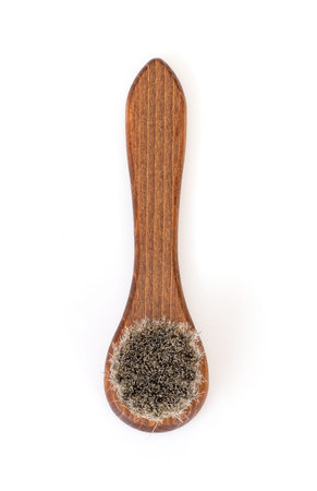 Bristle wooden brush for cleaning clothes and shoes isolated on white background
