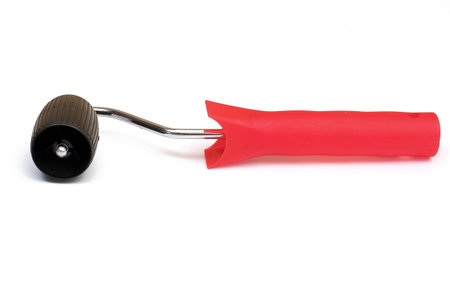 Hand tools for gluing wallpapers or drawing a picture on plaster isolated on a white background