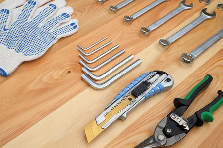 Various tools for handmade isolated on a wooden board