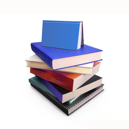 Stack of books in color covers with white sheets isolated on a white backgroundの写真素材