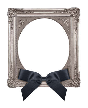 Silver frame with black mourning bow for paintings, mirrors or photo isolated on white backgroundの写真素材