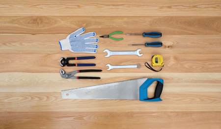 Various tools for handmade isolated on a wooden board