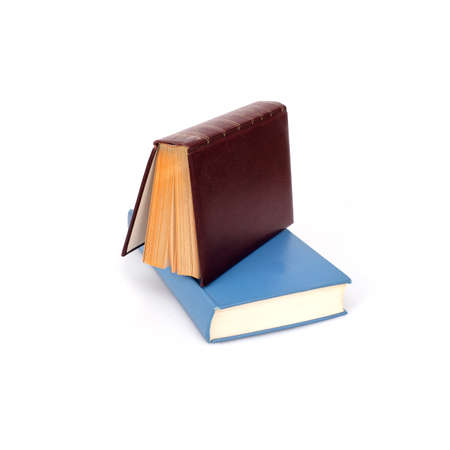Stack of books in color covers with white sheets isolated on a white backgroundの写真素材