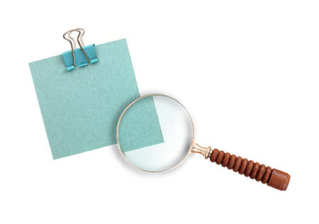 Magnifying glass (magnifier) and blue paper isolated on white backgroundの写真素材