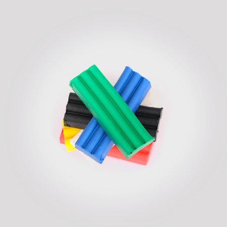 Stack of pieces of multicolored plasticine isolated on white backgroundの写真素材