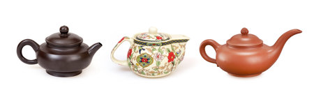 Set of ceramic handmade teapots isolated on a white backgroundの写真素材