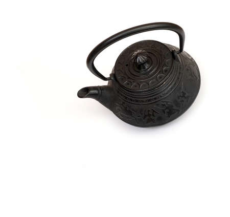 Cast iron Chinese teapot isolated on a white backgroundの写真素材