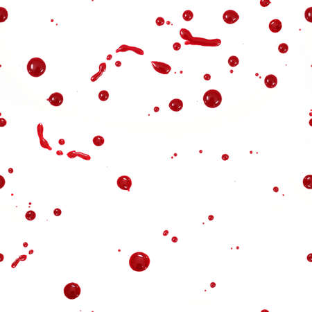 Seamless pattern: drops of red liquid (blood, nail polish, ketchup, dressing) isolated on white backgroundの写真素材