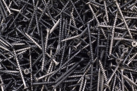 A bunch of nails, bolts, screws to create a isolated background