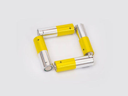 Compact electrolytic elements (batteries) on a white background