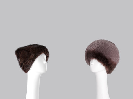 Mannequin head with fur hat isolated on a gray backgroundの写真素材