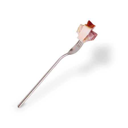 Metal fork with a bacon isolated on a white backgroundの写真素材