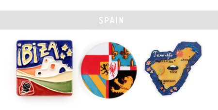 Magnetic souvenirs from Spain isolated on a white background. Names translated into English: Ibiza, Tenerife, De la Cruz, Santa Cruz, Teide volcano, Los Cristianosの写真素材