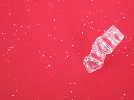 Concept of an isolated New Year poster with a white snow and ice on a red backgroundの写真素材