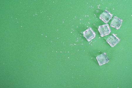 Concept of an isolated New Year poster with a white snow and ice on a green backgroundの写真素材