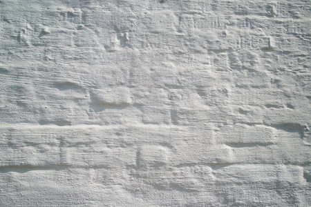Isolated whitewashed stone wall surface (for background)の写真素材