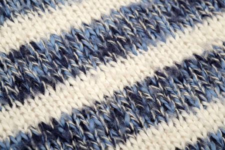 Isolated part of knitted blue and white wool plaid (background)