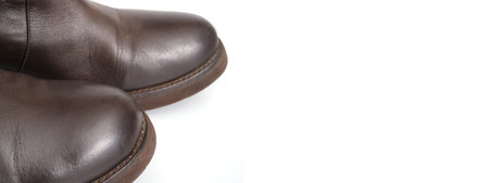Horizontal banner with toe of old leather boots isolated on white background banner with socks of old leather boots isolated on white backgroundの写真素材