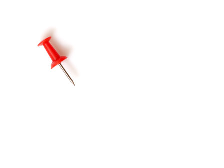 Red push pin isolated on a white backgroundの写真素材