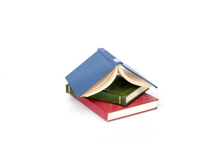 Stack of red, green and blue books isolated on a white backgroundの写真素材