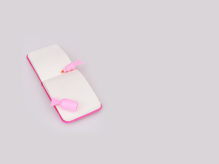 Composition (mockup) with pink notepad and pink marker isolated on white backgroundの写真素材