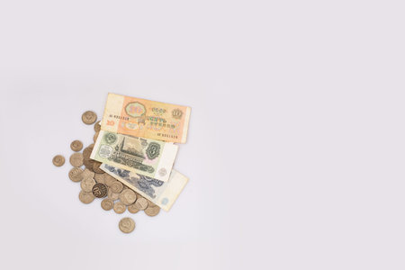 Old Soviet banknotes and coins. Isolated background