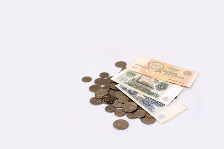 Old Soviet banknotes and coins. Isolated background