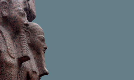 Ancient egyptian pink Aswan Granite heads of Ramesses II and the god Ptah from the Temple of Ptah at...