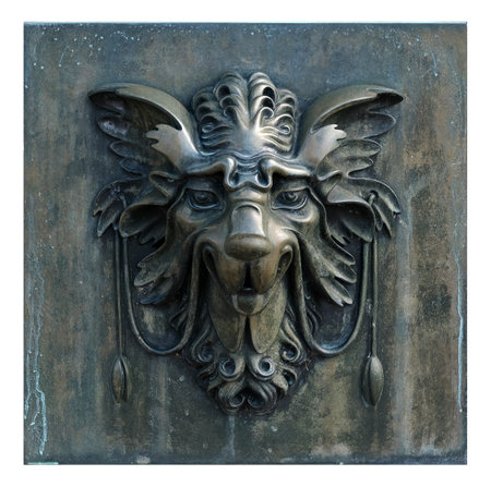 Decorative architectural bronze mask isolated on white background. Design element with clipping pathの写真素材