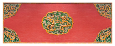 View of the courtyard of the Forbidden City (Beijing, Gugong): ceramic ornament with dragons against the background of a red wall. Design element with clipping pathの写真素材