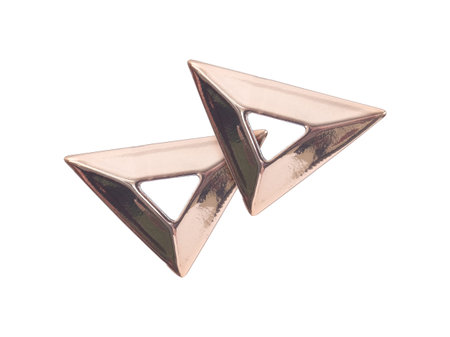 Golden triangular rivets for decorating clothing and accessories isolated on white background....