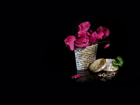 Bouquet of cyclamens in a vase isolated on black background