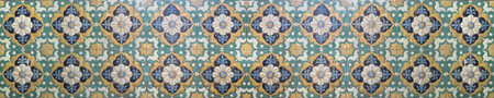 A repeating seamless pattern of intricately designed ceramics floral tiles covers the entire image