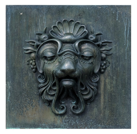 Decorative architectural bronze mask isolated on white background. Design element with clipping pathの写真素材