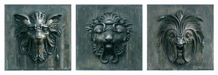 Decorative architectural bronze masks isolated on white backgroundの写真素材