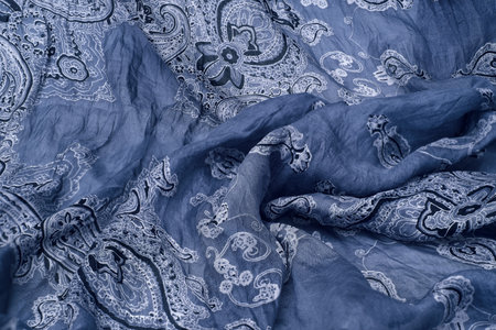 Isolated background: blue silk fabric with classic paisley pattern