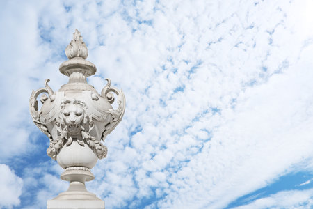 Antique marble park vase isolated on blue sky. Travel poster template. Design element with clipping pathの写真素材