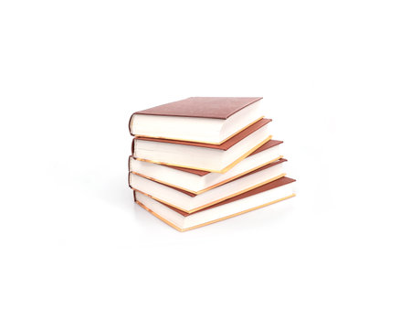 Stack of books in brown cover with white sheets isolated on a white backgroundの写真素材