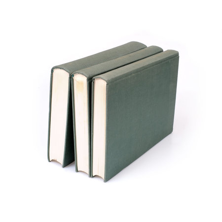 Stack of green books isolated on a white backgroundの写真素材