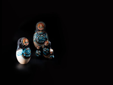 Russian national souvenir (Matrioshka)isolated on a black backgroundの写真素材