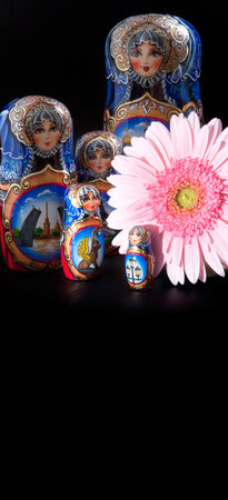 Russian national souvenir (Matrioshka) isolated on a black background