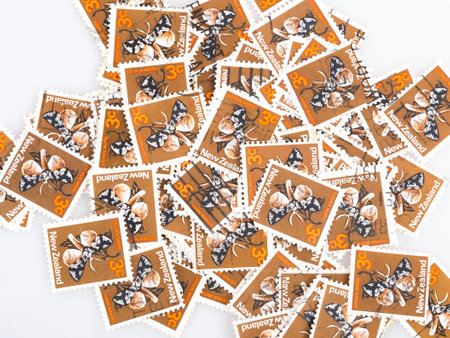 Background of bright New Zealand postage stamps depicting the lichen mothの写真素材