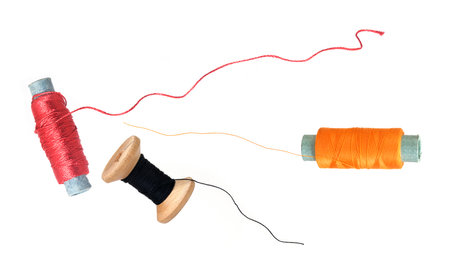 Three spools of thread isolated on a white backgroundの写真素材
