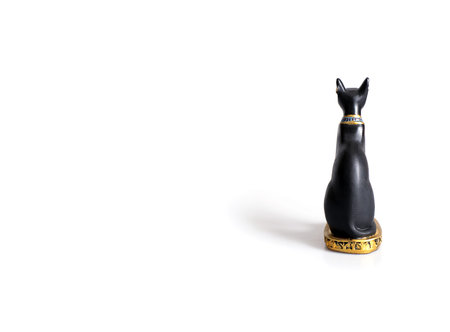 Souvenir from Egypt (goddess Bastet in the form of a black cat) isolated on white background