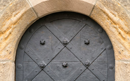 Wall of a medieval castle with a door. Isolated backgroundの写真素材